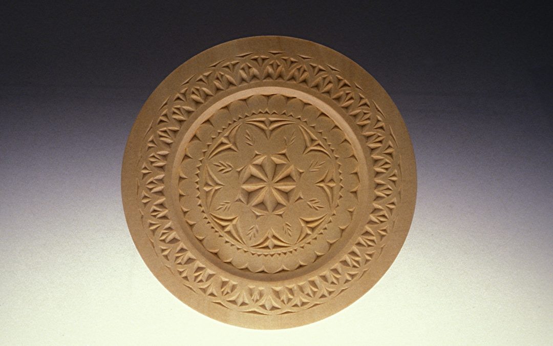 Decorative circular wood carving by Kenneth Nelson